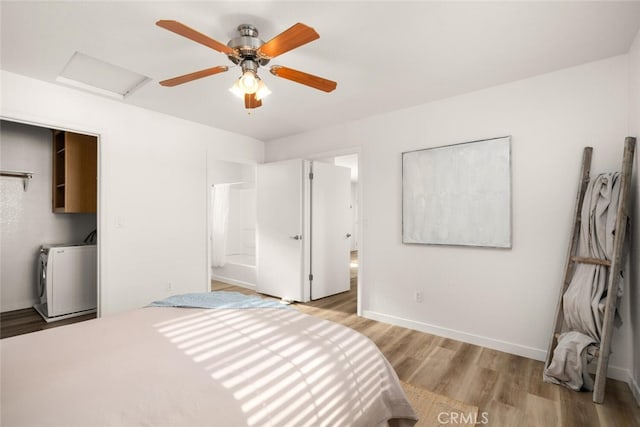 bedroom featuring ceiling fan, washer / dryer, and light hardwood / wood-style flooring