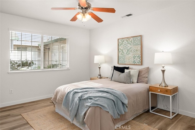 bedroom featuring ceiling fan and hardwood / wood-style floors