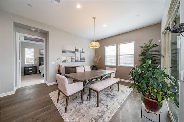 dining area with dark wood-type flooring