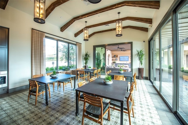 sunroom featuring vaulted ceiling with beams