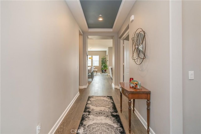 hall with dark wood-type flooring