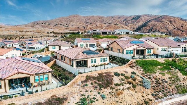 birds eye view of property with a mountain view