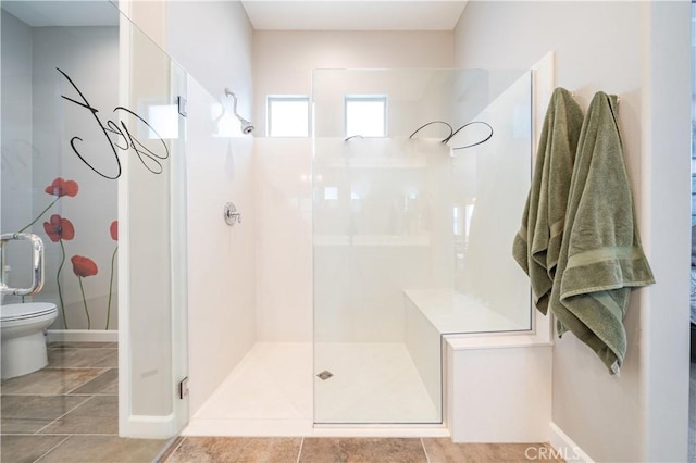 bathroom featuring a shower with shower door