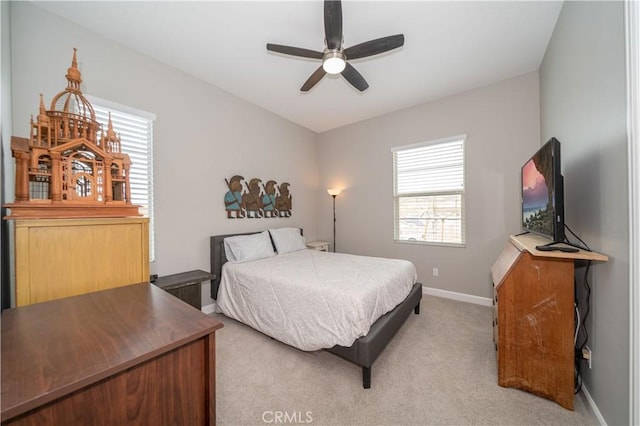 bedroom featuring ceiling fan and light carpet