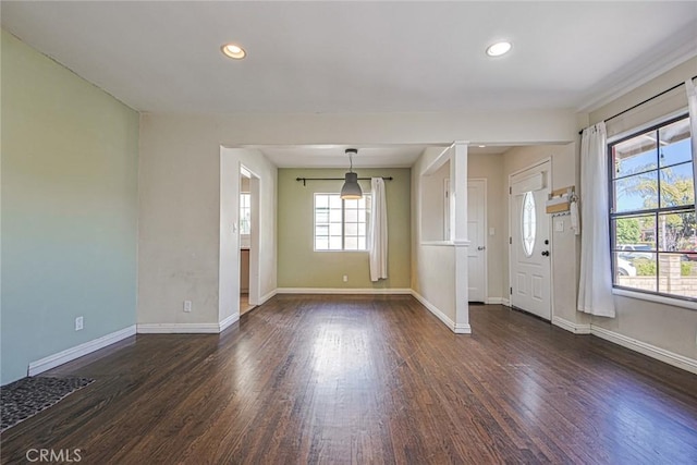 spare room featuring dark wood-type flooring