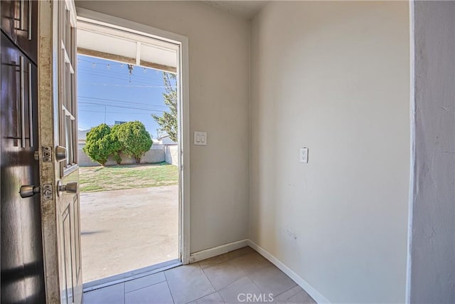 entryway with light tile patterned floors