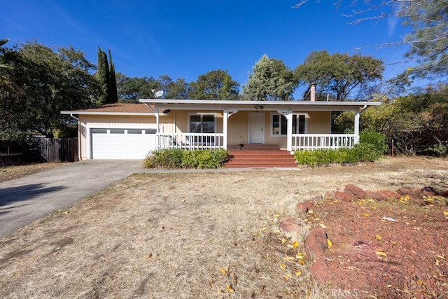 18686 Marine View Rd, Hidden Valley Lake, CA 95467 - single story home with concrete driveway, a porch, and an attached garage