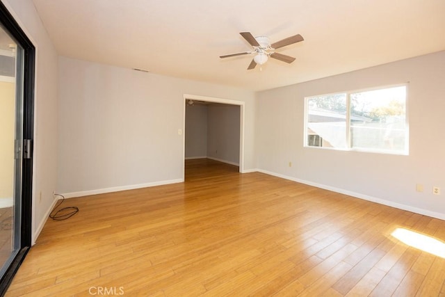 spare room featuring light hardwood / wood-style flooring and ceiling fan