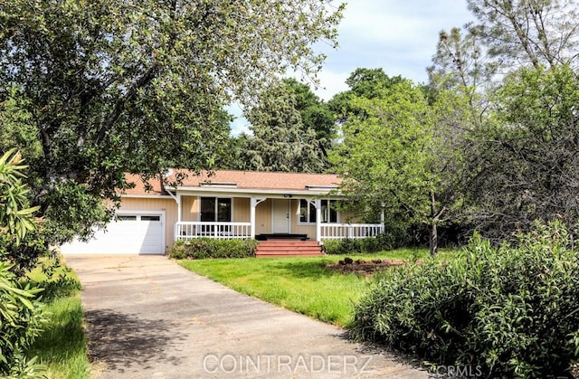 18686 Marine View Rd, Hidden Valley Lake, CA 95467 - ranch-style home featuring covered porch, a garage, driveway, and a front lawn