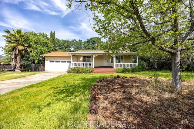 18686 Marine View Rd, Hidden Valley Lake, CA 95467 - view of front of home with a front yard, a porch, an attached garage, fence, and concrete driveway