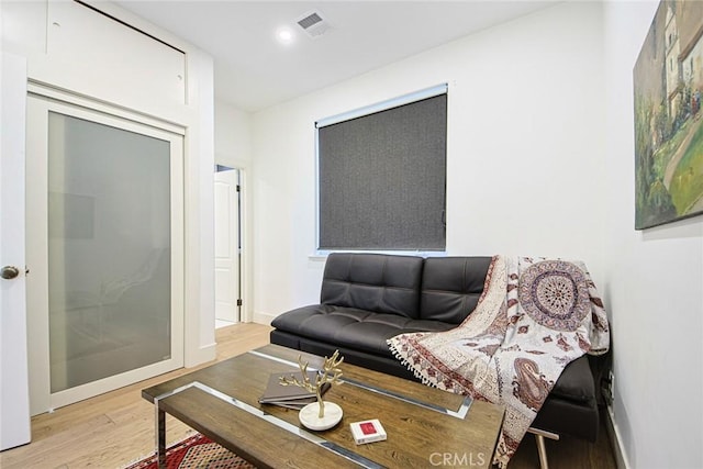 living room with light hardwood / wood-style floors