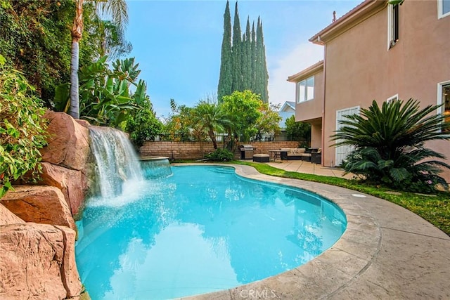 view of swimming pool featuring a patio