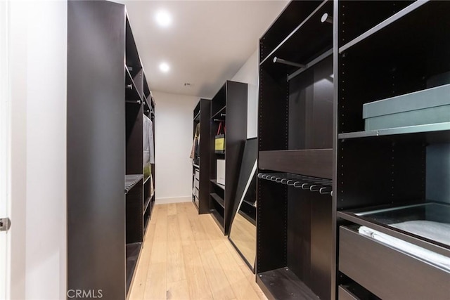 spacious closet featuring light wood-type flooring