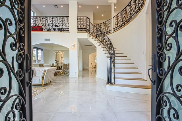 foyer featuring a high ceiling