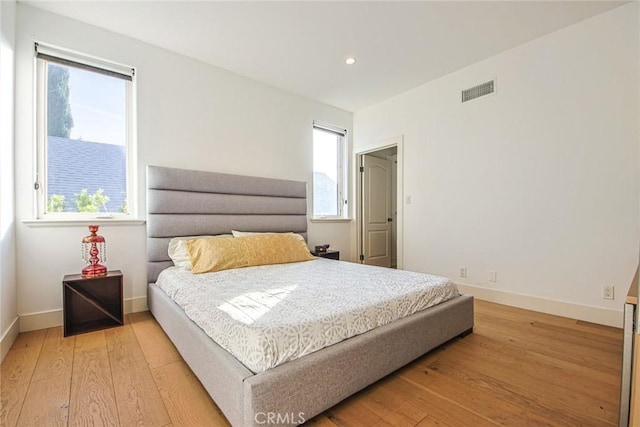 bedroom featuring light hardwood / wood-style floors