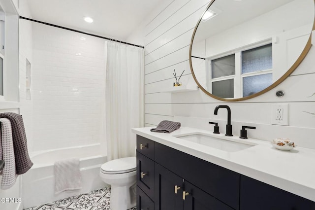 full bathroom featuring tile patterned floors, vanity, toilet, and shower / tub combo