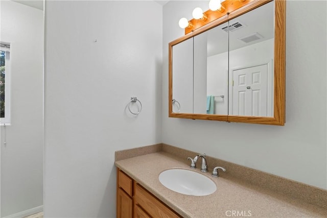 bathroom featuring visible vents and vanity