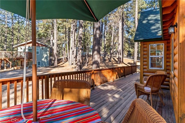 wooden deck with an outdoor structure