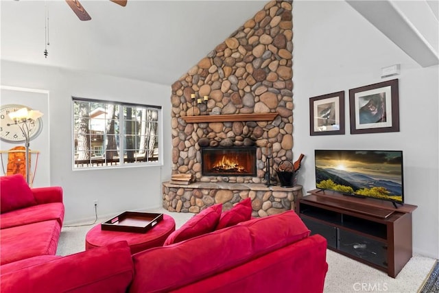 living room featuring carpet, a fireplace, vaulted ceiling, and a ceiling fan