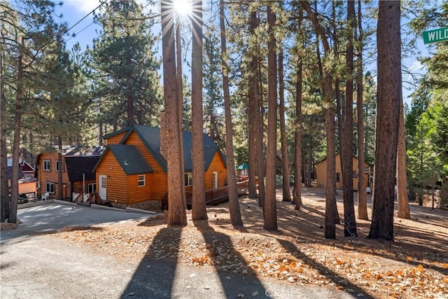 view of front of house featuring log veneer siding