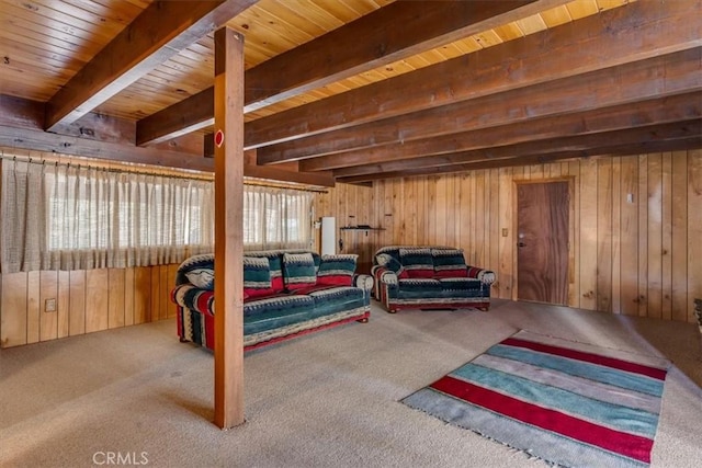 carpeted bedroom with beamed ceiling, wooden ceiling, and wood walls