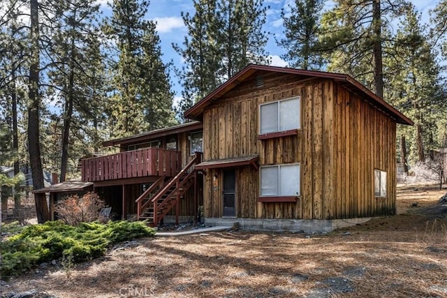 view of front of home with a wooden deck