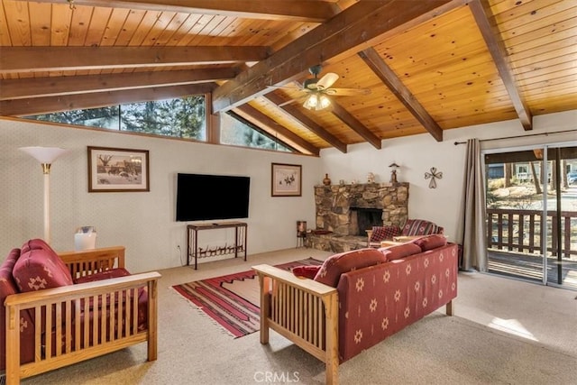 carpeted living room featuring lofted ceiling with beams, ceiling fan, wood ceiling, and a fireplace