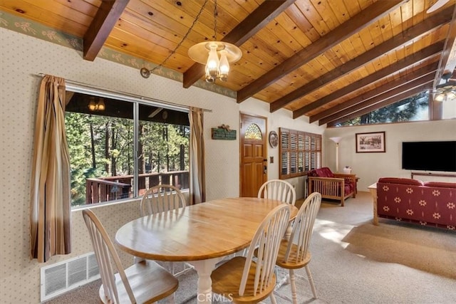 dining room with wood ceiling, carpet flooring, and vaulted ceiling with beams