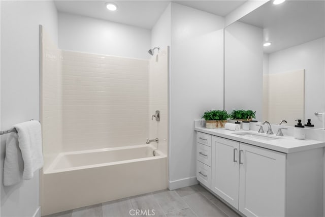 bathroom featuring shower / washtub combination and vanity