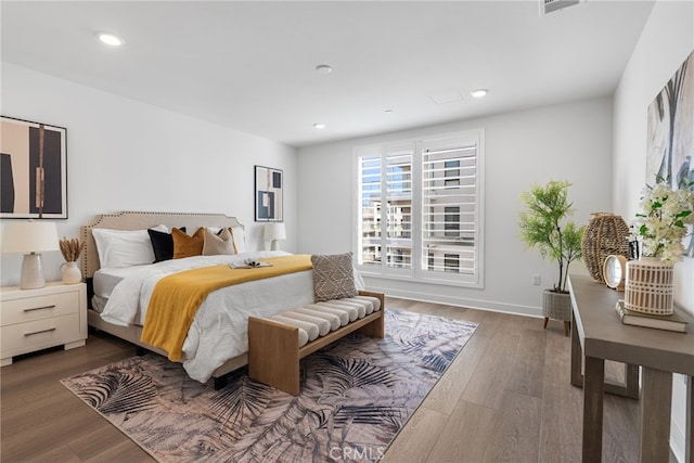 bedroom featuring dark hardwood / wood-style floors