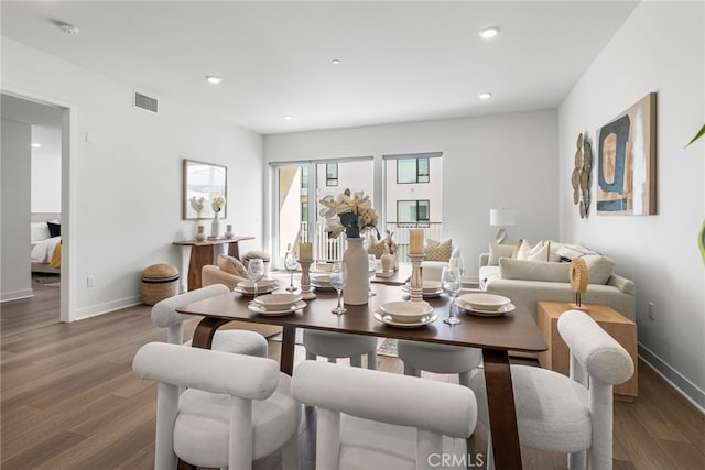 dining space featuring dark hardwood / wood-style flooring