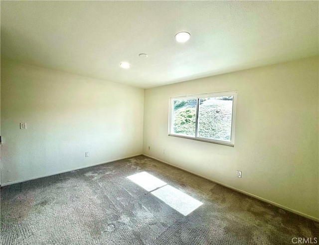 empty room featuring carpet flooring