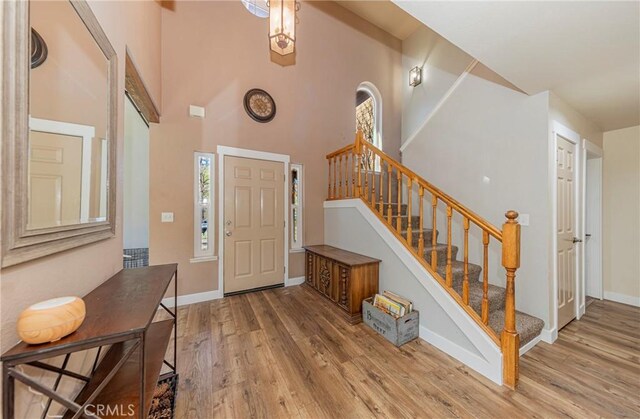 36763 Venado Dr, Coarsegold, CA 93614 - entryway featuring wood finished floors, stairs, and a high ceiling