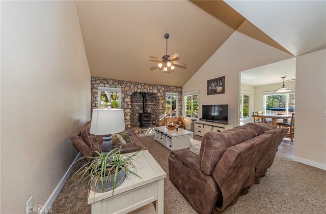 36763 Venado Dr, Coarsegold, CA 93614 - living area with a wood stove, high vaulted ceiling, light carpet, plenty of natural light, and a ceiling fan