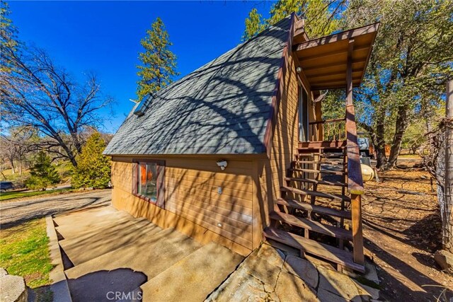 36763 Venado Dr, Coarsegold, CA 93614 - view of home's exterior with stairs and a shingled roof