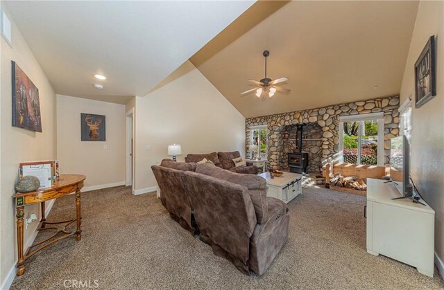 36763 Venado Dr, Coarsegold, CA 93614 - living room with a wood stove, light colored carpet, a ceiling fan, and vaulted ceiling