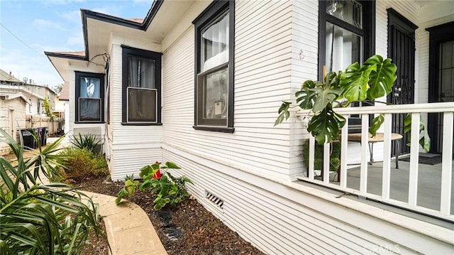 view of side of property featuring a porch