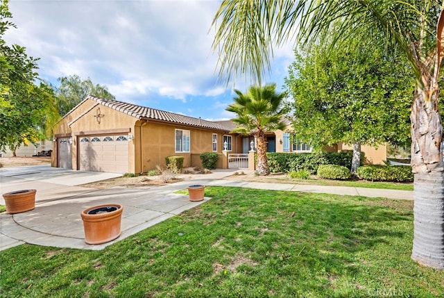 view of front facade with a garage and a front yard