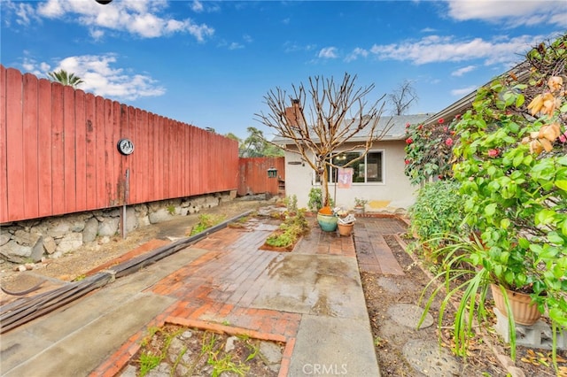 view of patio featuring fence