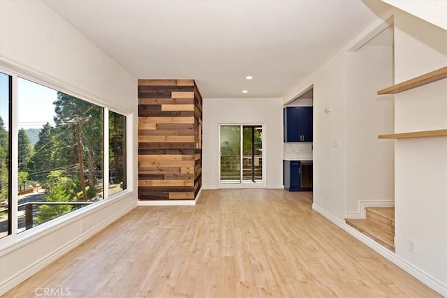 unfurnished living room with light wood-type flooring