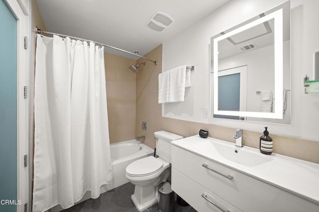 full bathroom with vanity, shower / bathtub combination with curtain, and toilet