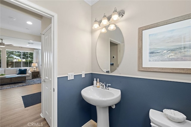 bathroom featuring a ceiling fan, recessed lighting, toilet, and wood finished floors