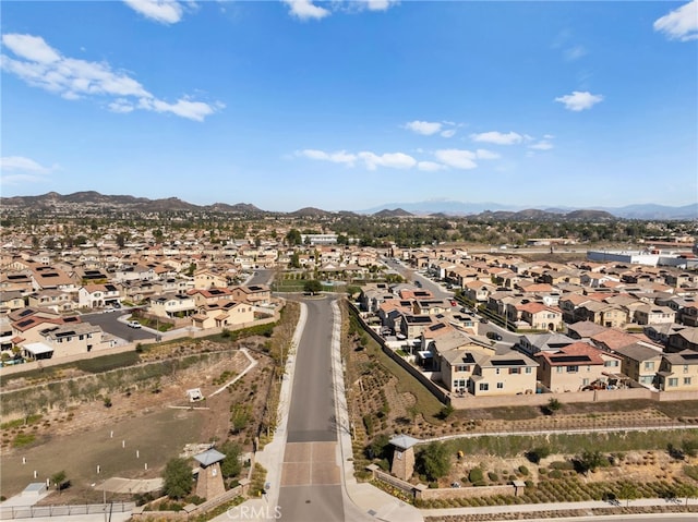 birds eye view of property with a residential view and a mountain view