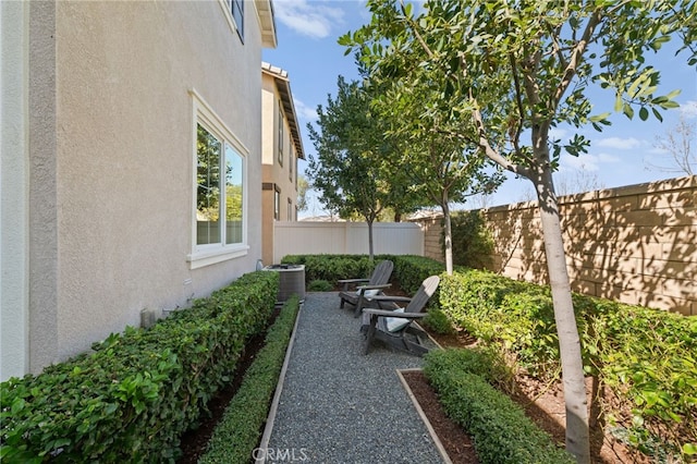 view of patio / terrace featuring a fenced backyard and central AC