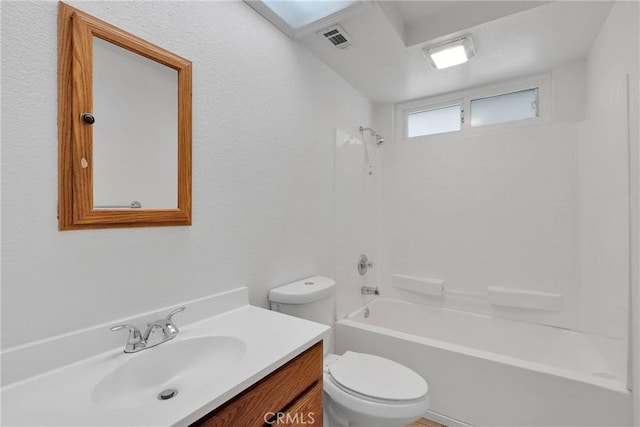 full bathroom featuring vanity, shower / bathtub combination, and toilet