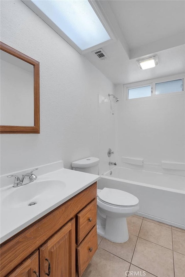 full bathroom with tile patterned flooring, vanity, shower / tub combination, and toilet