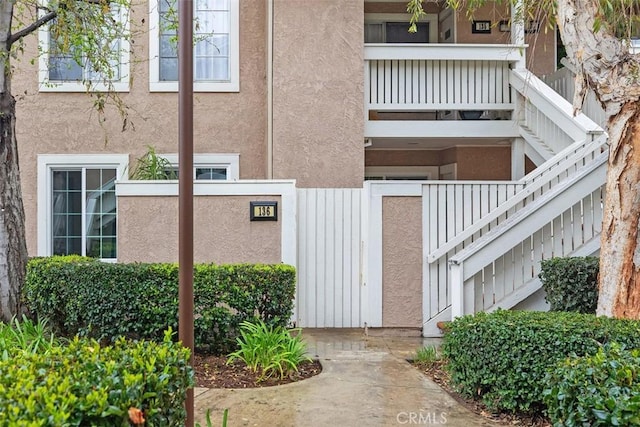 view of property featuring stairway