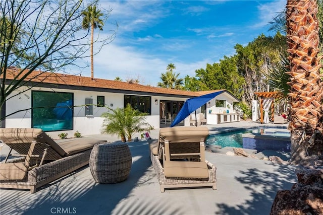 back of property featuring outdoor lounge area and a patio