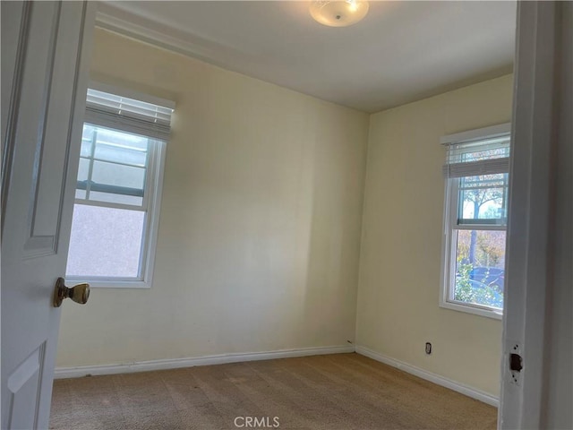 empty room with light colored carpet