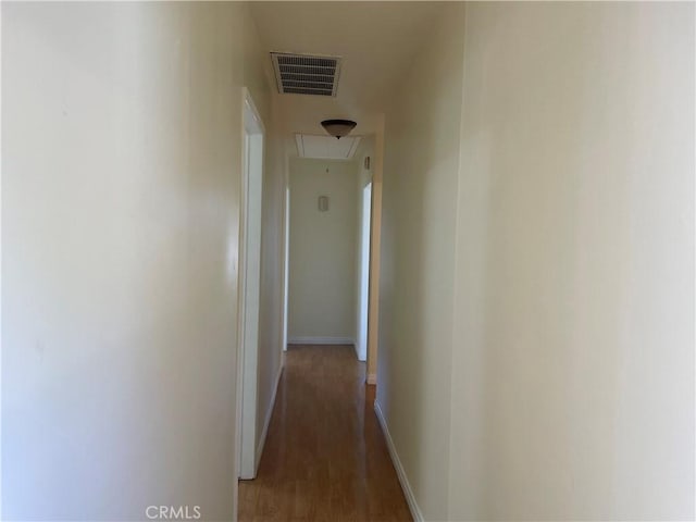 corridor with dark wood-type flooring